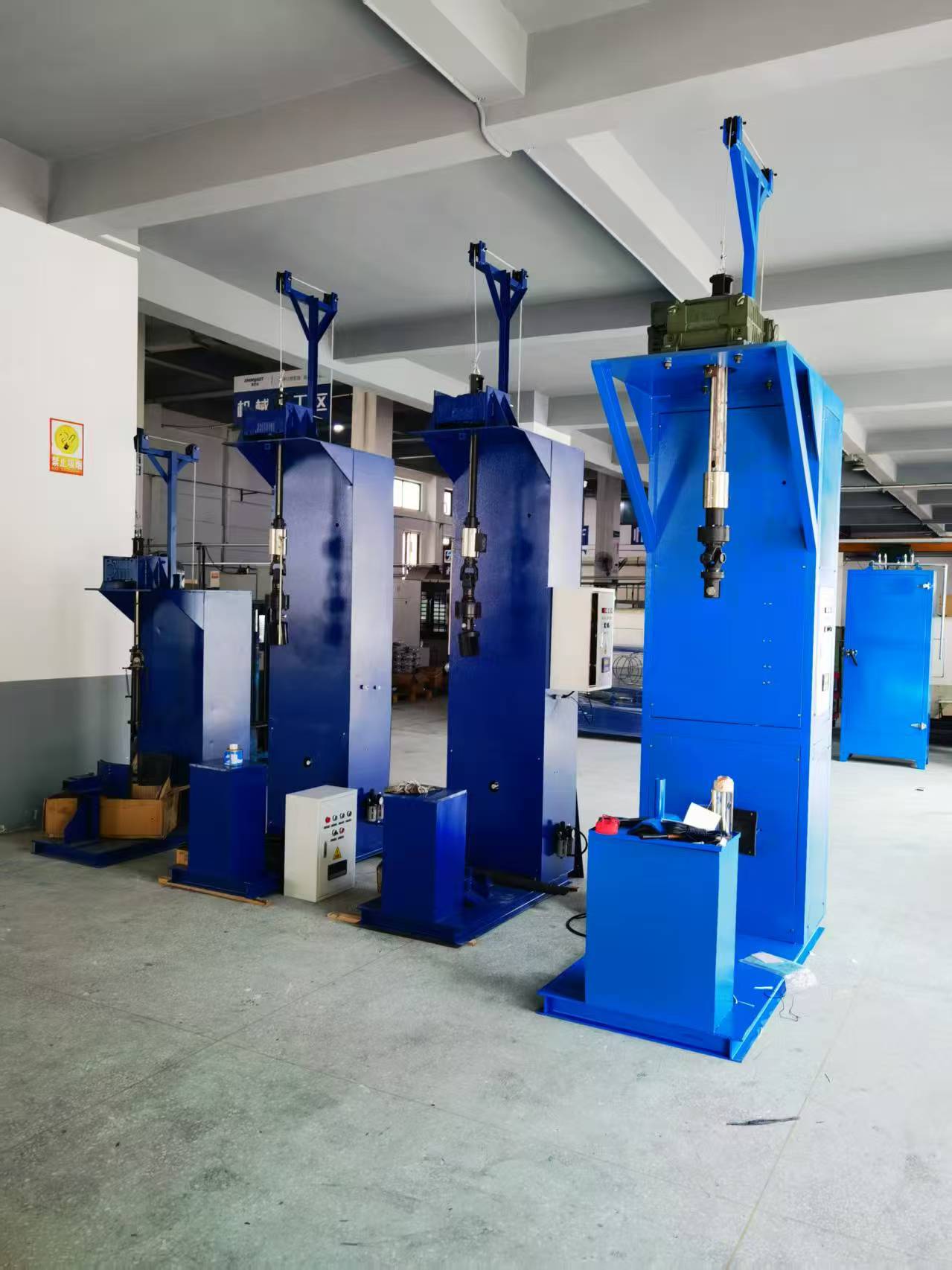 UNITYCH gas cylinder valve handling machines installed in a factory